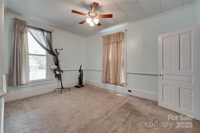302 Charlotte St, York, SC 29745 - workout area with a ceiling fan, carpet flooring, ornamental molding, and a healthy amount of sunlight