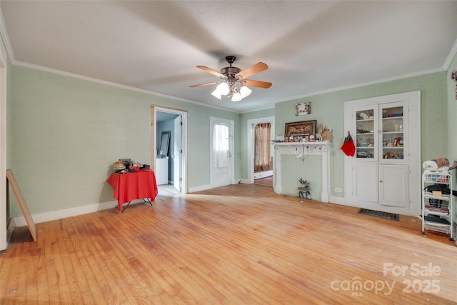 302 Charlotte St, York, SC 29745 - interior space with visible vents, baseboards, wood finished floors, ceiling fan, and crown molding