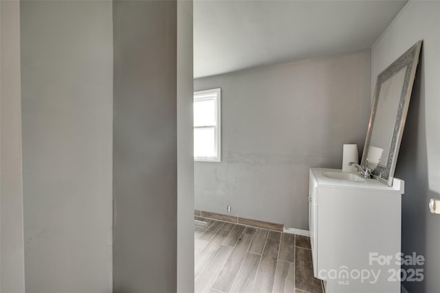 302 Charlotte St, York, SC 29745 - laundry room with wood finish floors, baseboards, and a sink