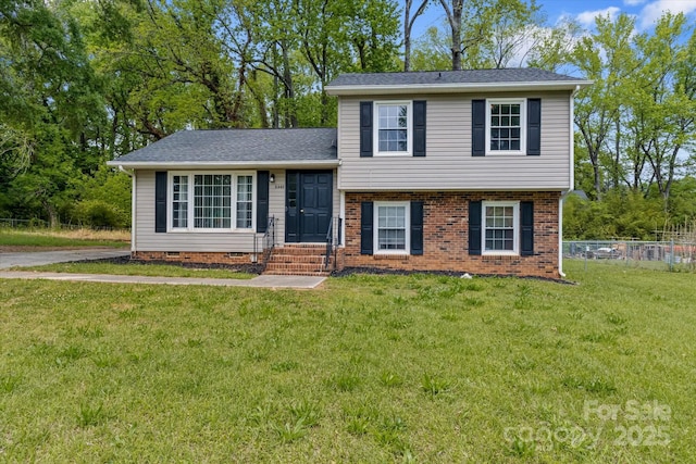 6443 Eaglecrest Rd, Charlotte, NC 28212 - tri-level home with a front yard, brick siding, and fence