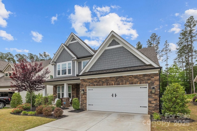 1548 Striped Bass Ln, Clover, SC 29710 - craftsman inspired home featuring an attached garage, a shingled roof, stone siding, and concrete driveway