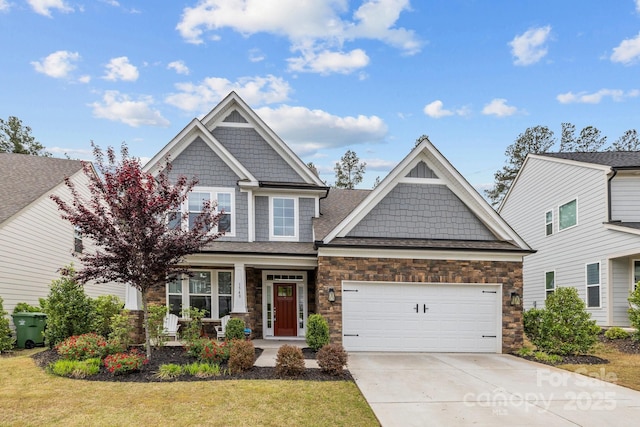 1548 Striped Bass Ln, Clover, SC 29710 - craftsman house featuring an attached garage, stone siding, a porch, a front yard, and driveway