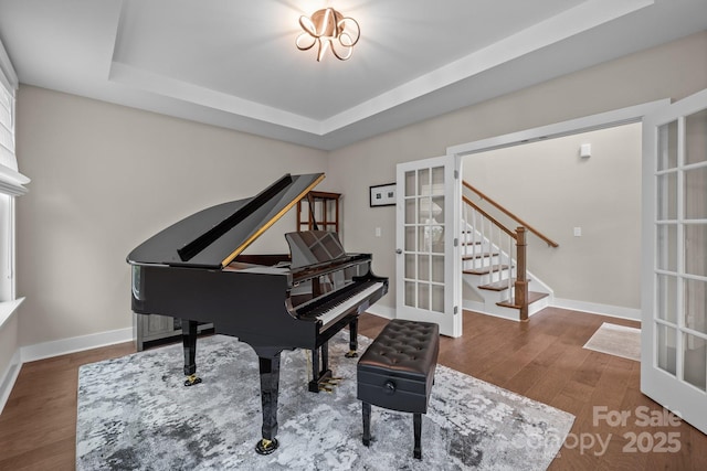 1548 Striped Bass Ln, Clover, SC 29710 - living area with a raised ceiling, french doors, stairs, baseboards, and wood finished floors