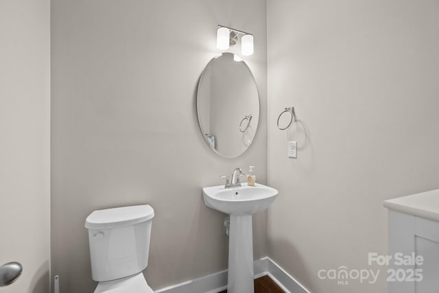 1548 Striped Bass Ln, Clover, SC 29710 - half bathroom with a sink, baseboards, and toilet