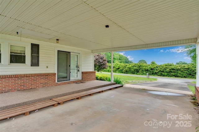 543 18th St NW, Hickory, NC 28601 - view of patio / terrace with an attached carport