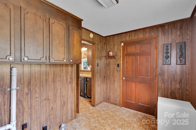 543 18th St NW, Hickory, NC 28601 - entrance foyer featuring wooden walls, ornamental molding, and light floors