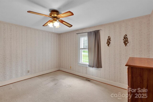 543 18th St NW, Hickory, NC 28601 - spare room with carpet flooring, ceiling fan, and baseboards