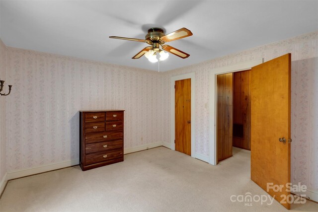 543 18th St NW, Hickory, NC 28601 - unfurnished bedroom featuring carpet, ceiling fan, and baseboards