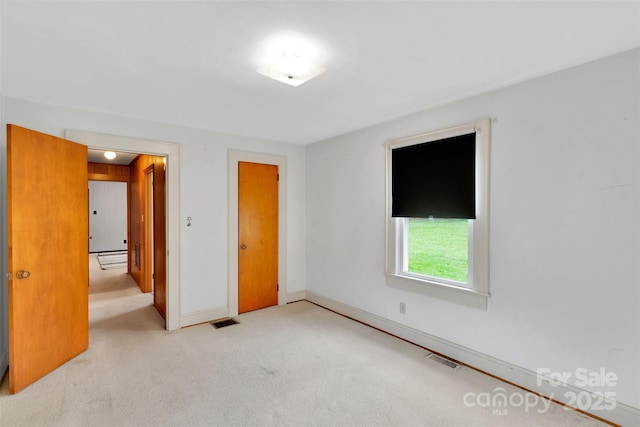 543 18th St NW, Hickory, NC 28601 - unfurnished bedroom with carpet flooring and baseboards