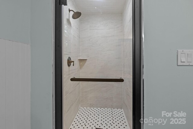 bathroom featuring a shower stall