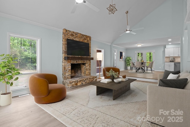 2701 Wimbledon Dr, Gastonia, NC 28056 - living area featuring ceiling fan, ornamental molding, a fireplace, wood finished floors, and vaulted ceiling
