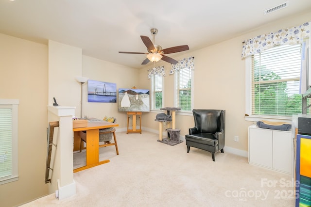 sitting room featuring ceiling fan, carpet, and baseboards