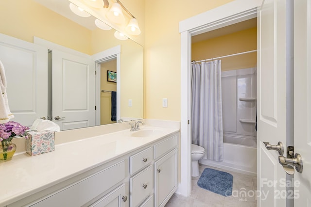 bathroom with vanity, toilet, tile patterned floors, and shower / tub combo