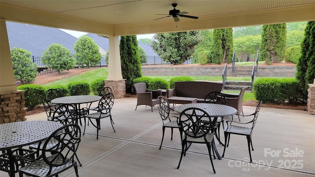 view of patio / terrace with outdoor dining space, a ceiling fan, and fence