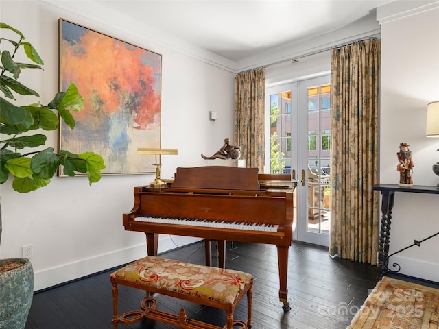 living area featuring french doors, baseboards, and hardwood / wood-style flooring
