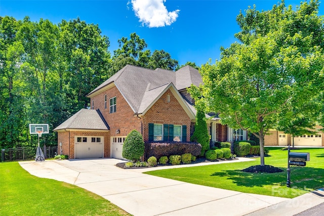 618 Chase Ct, Fort Mill, SC 29708 - traditional-style house with brick siding, concrete driveway, a garage, and a shingled roof