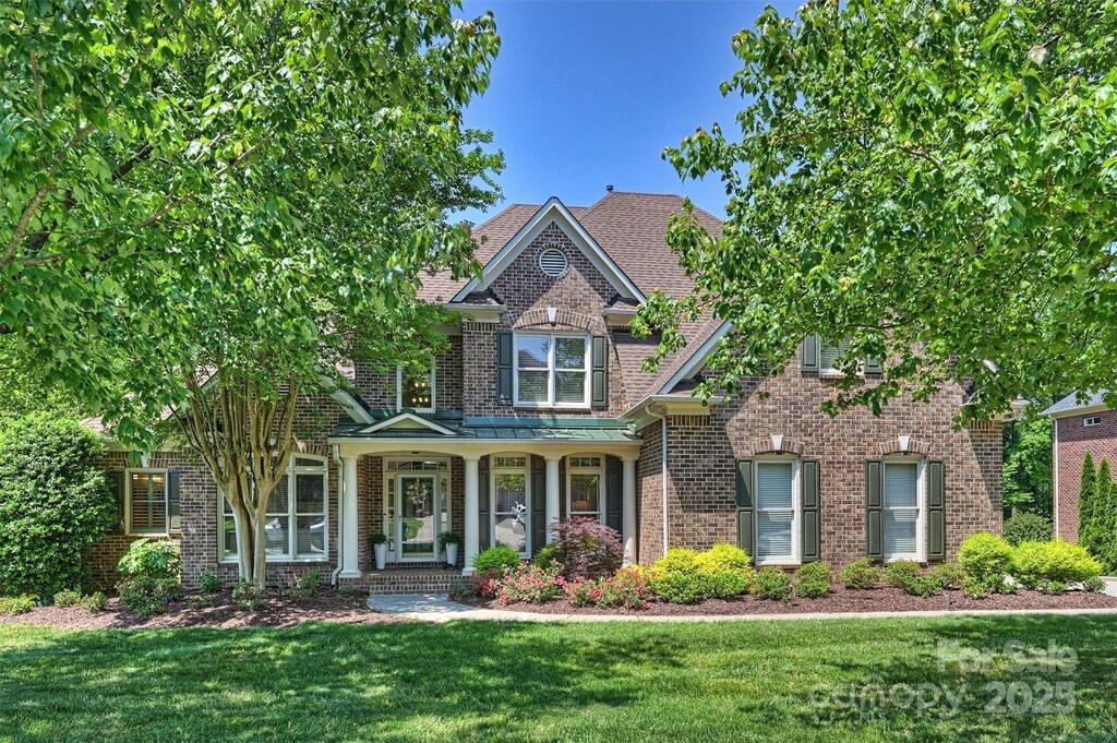 16430 New Providence Ln, Charlotte, NC 28277 - craftsman inspired home with a front yard, brick siding, and covered porch