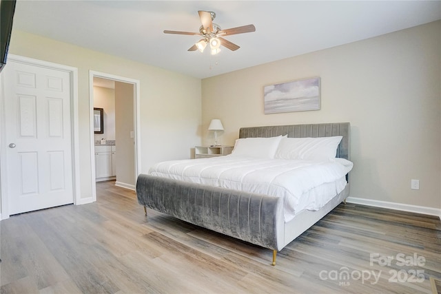 809 Fisher St, Concord, NC 28027 - bedroom with wood finished floors, ensuite bathroom, and ceiling fan
