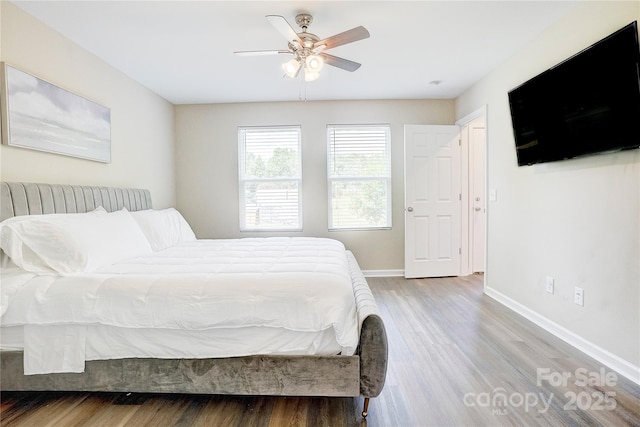 809 Fisher St, Concord, NC 28027 - bedroom with wood finished floors and a ceiling fan