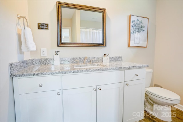 809 Fisher St, Concord, NC 28027 - full bath with vanity and wood finished floors