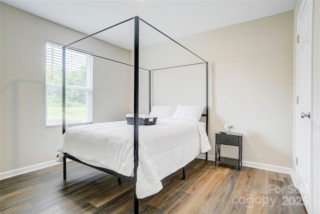 809 Fisher St, Concord, NC 28027 - bedroom featuring wood finished floors and baseboards