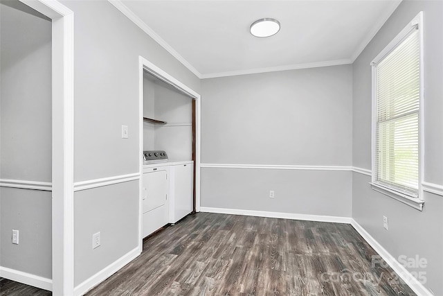 interior space featuring separate washer and dryer, crown molding, baseboards, and dark wood-style floors