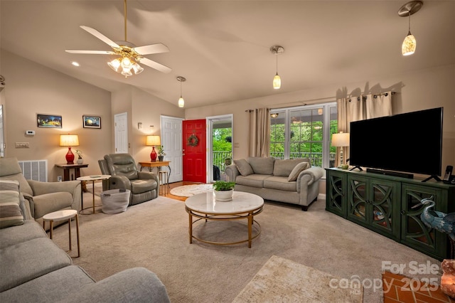 carpeted living room featuring a ceiling fan, vaulted ceiling, and visible vents