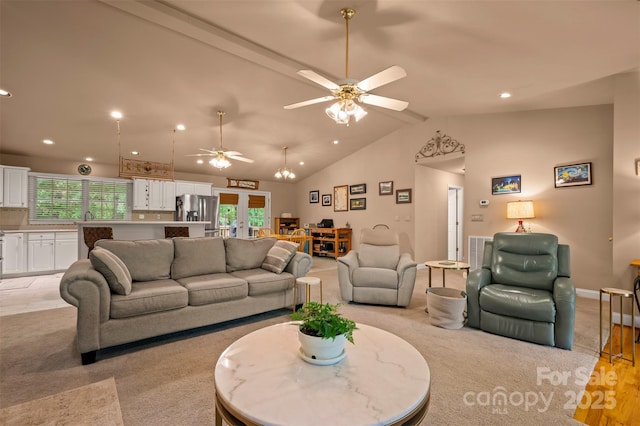 living room featuring vaulted ceiling, ceiling fan, french doors, and recessed lighting