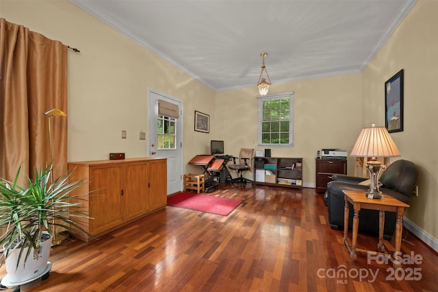 interior space featuring baseboards, ornamental molding, and wood finished floors