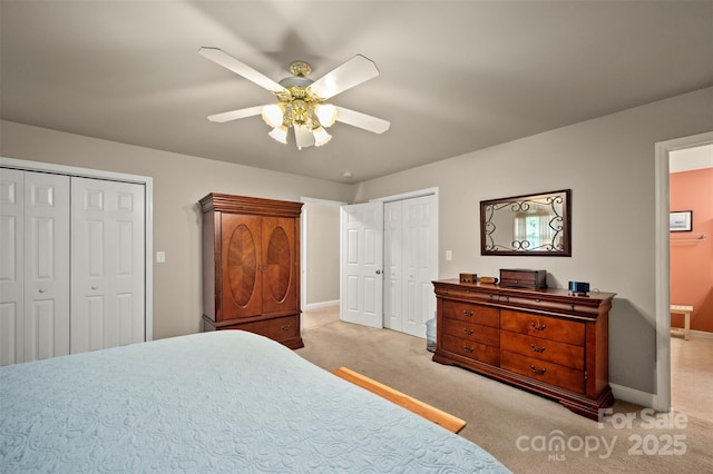 bedroom featuring baseboards, a ceiling fan, and light carpet