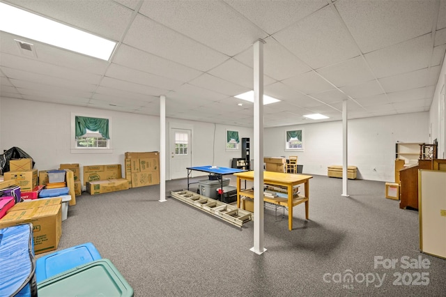 rec room featuring carpet floors and a drop ceiling