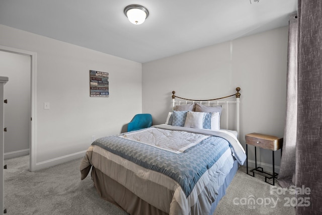 carpeted bedroom featuring baseboards