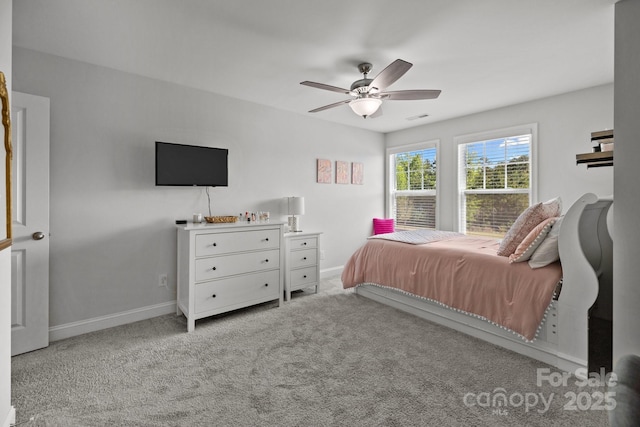 bedroom featuring visible vents, baseboards, carpet floors, and ceiling fan