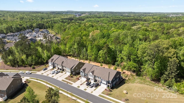 bird's eye view with a view of trees and a residential view
