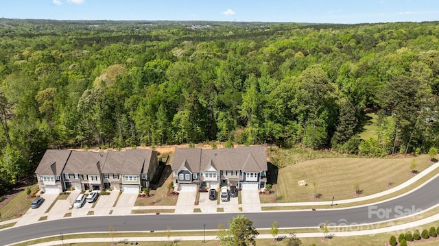 aerial view featuring a wooded view