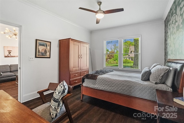 bedroom with ornamental molding, baseboards, dark wood-style flooring, and a ceiling fan