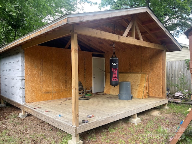 view of outdoor structure featuring fence