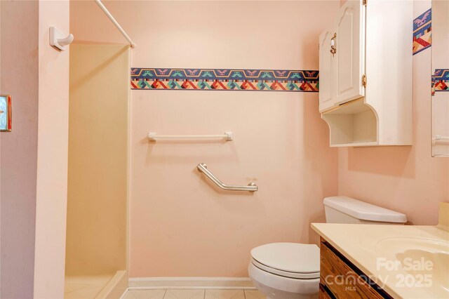 full bath featuring tile patterned flooring, toilet, vanity, and a shower