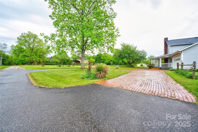 exterior space with aphalt driveway