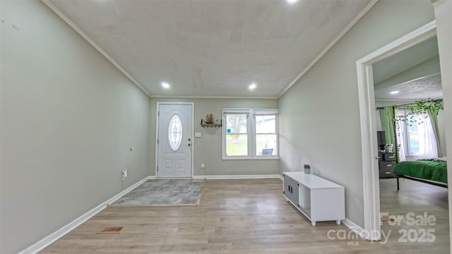 8140 Karriker Rd, Kannapolis, NC 28081 - foyer entrance featuring ornamental molding, light wood finished floors, recessed lighting, and baseboards