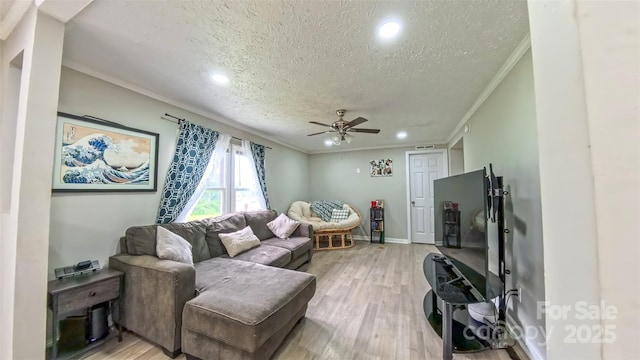8140 Karriker Rd, Kannapolis, NC 28081 - living area with a textured ceiling, crown molding, a ceiling fan, light wood finished floors, and recessed lighting