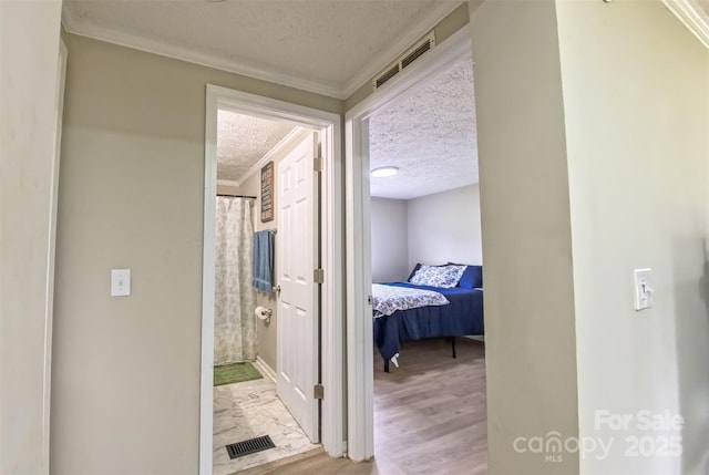 8140 Karriker Rd, Kannapolis, NC 28081 - corridor featuring a textured ceiling and crown molding