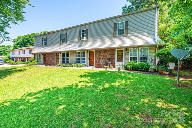 230 Park Ln, Newton, NC 28658 - view of front of home featuring a front lawn and brick siding