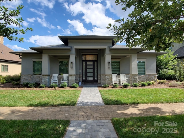 60 Running Creek Trl, Arden, NC 28704 - prairie-style house featuring stucco siding, stone siding, and a porch