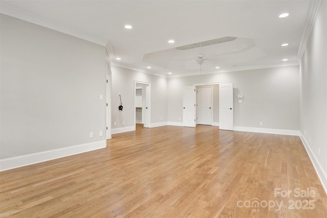 empty room with recessed lighting, light wood-style flooring, baseboards, and ornamental molding