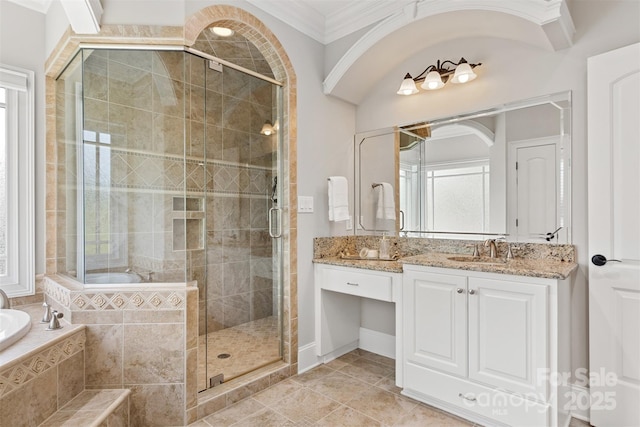 bathroom featuring a garden tub, ornamental molding, vanity, and a stall shower