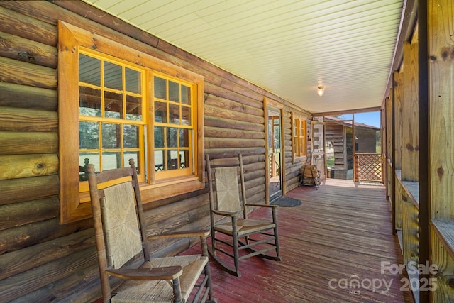 1154 Woodrow Pl, Lenoir, NC 28645 - wooden deck with covered porch