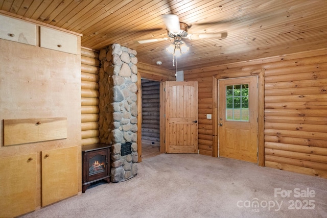 1154 Woodrow Pl, Lenoir, NC 28645 - unfurnished living room with carpet, wood ceiling, a ceiling fan, and rustic walls