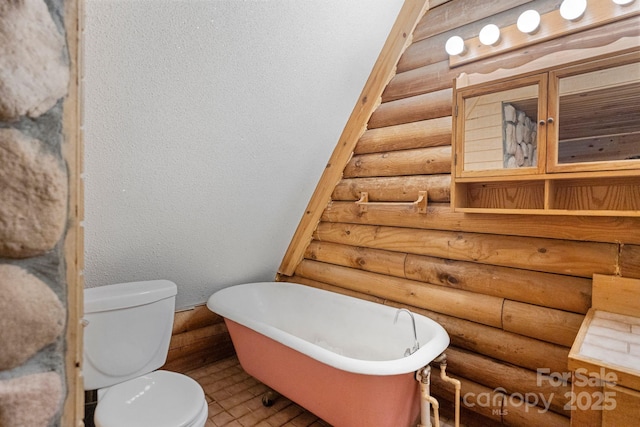 1154 Woodrow Pl, Lenoir, NC 28645 - bathroom with log walls, toilet, a soaking tub, and a textured wall