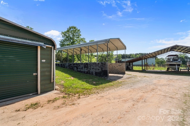 1154 Woodrow Pl, Lenoir, NC 28645 - view of parking / parking lot featuring a carport and dirt driveway